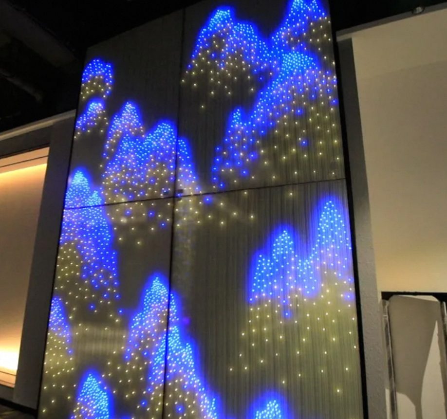 LED glass curtain wall showing blue animated content