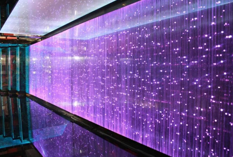 LED glass screen forming an illuminated walkway tunnel