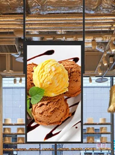 Wall-mounted high brightness signage display in a cafe